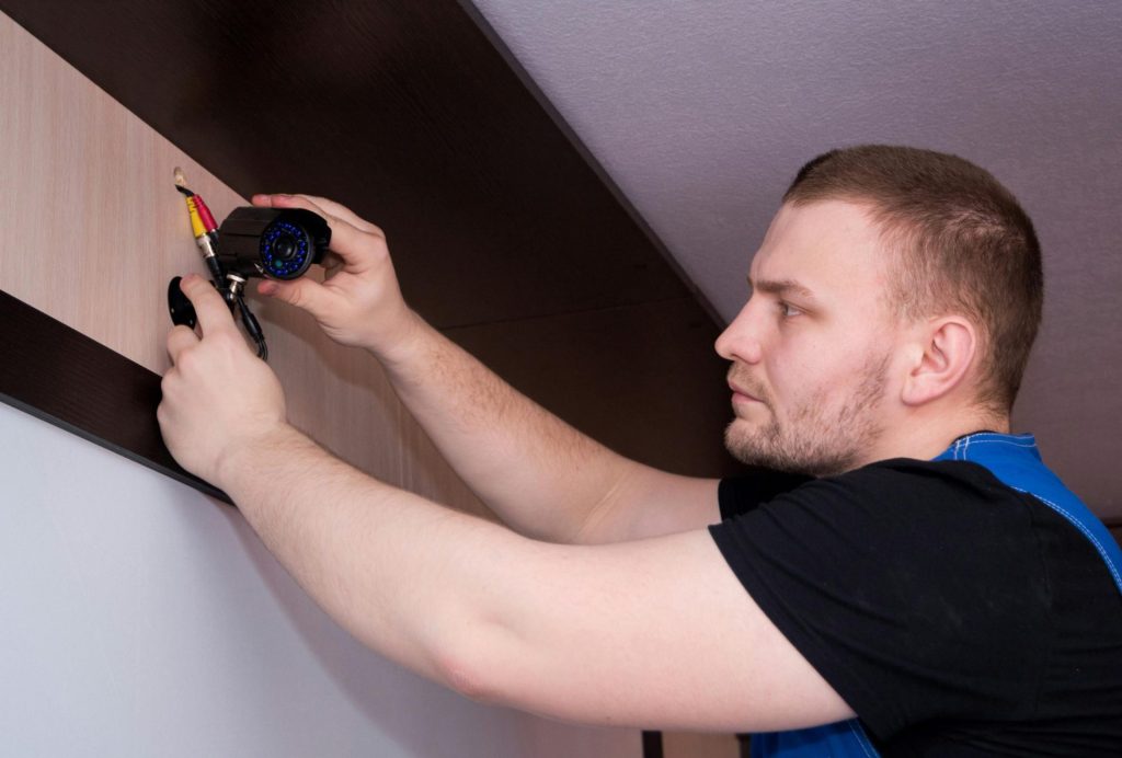 Person installing surveillance camera