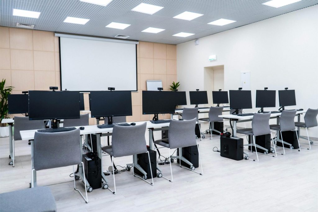 Meeting room with computers and chairs